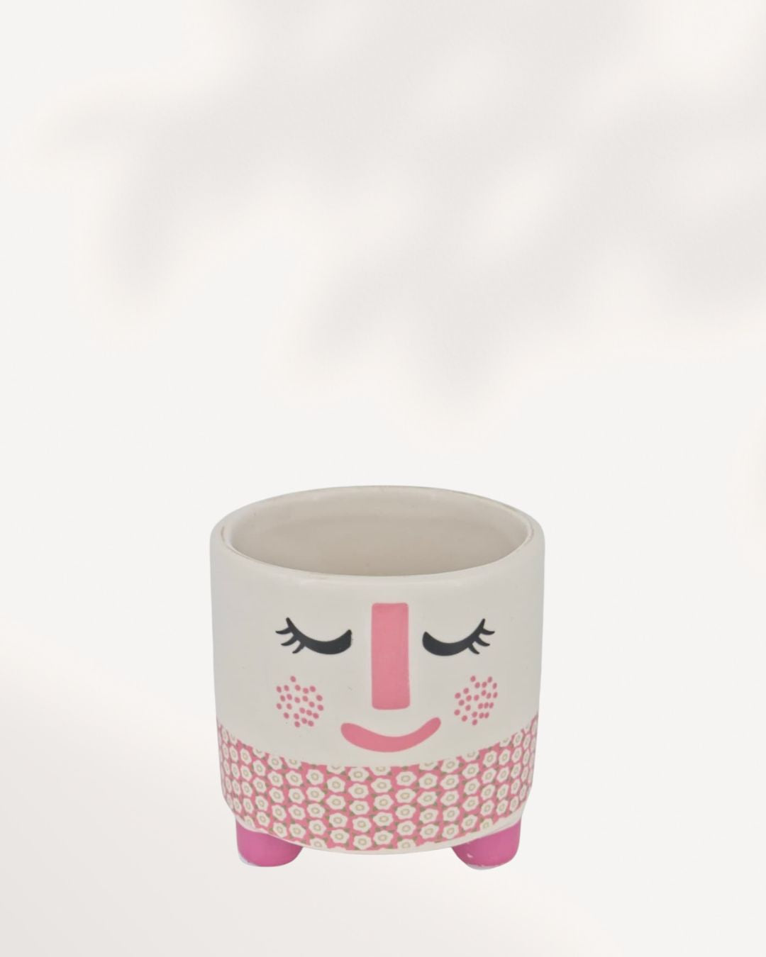 Small ceramic and clay Rosie Pot featuring a white, rosy pink, and charcoal accent color palette.