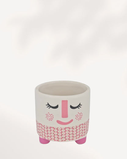 Small ceramic and clay Rosie Pot featuring a white, rosy pink, and charcoal accent color palette.