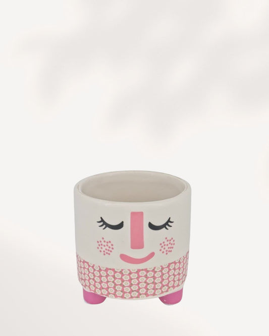 Small ceramic and clay Rosie Pot featuring a white, rosy pink, and charcoal accent color palette.